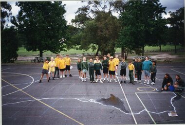 Photograph, Southwood Primary School - photograph of students on quadrangle  with a large  map of Australia drawn on the ground