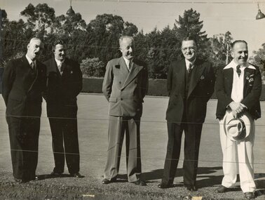Photograph, Ringwood Bowls Club - Opening day in the 1953-54 season at the Miles Avenue green, with one Ringwood bowler and some officials