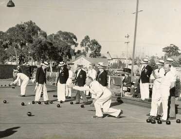 Photograph, Ringwood Bowls Club - Opening day in the 1953-54 season at the Miles Avenue green, looking East, showing bowlers competing on the green