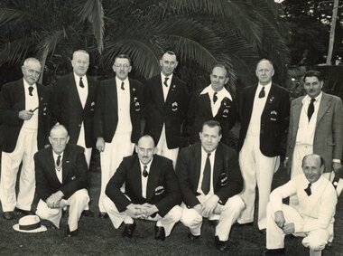 Photograph, Ringwood Bowls Club - Opening day in the 1954-55 season at the Miles Avenue green, near a palm tree, showing a group of Ringwood bowlers