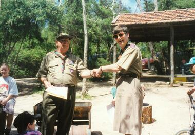 Photograph, Claire Edmanson presenting Scouting award to  Bob Oke