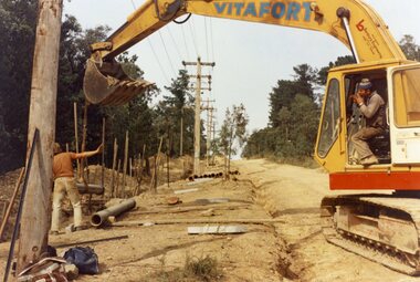 Photograph, The Kato working in Glenvale Road, North Ringwood, in April 1978. Laying pipes from the MMBW