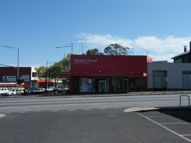 Photograph, Maroondah Highway, Ringwood showing Hocking Stuart (estate agents) in 2008. Former Coles and other businesses