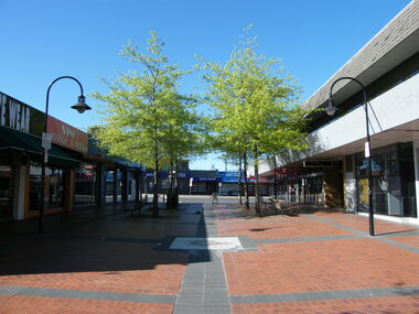 Photograph, Former Melbourne Street showing various shops and businesses, including NAB Bank, in 2008. Now demolished for new Eastland expansion