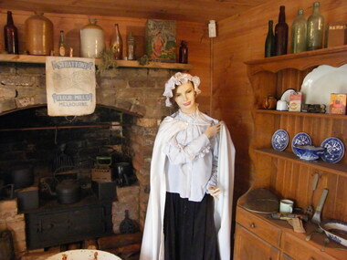 Photograph, Showing the interior views of the facsimile of the miner's hut, located at the back of Ringwood Lake, from the original that once stood on Maroondah Highway in the 1870s onwards. The cottage was erected by the Ringwood City Council in conjunction with Ringwood Historical Research Group (now Ringwood & District Historical Society). Officially opened by Mayor Cr Pat Gotlib JP on 29th May 1983