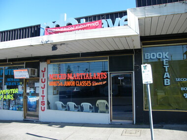 Photograph, Computer repairs shop, MixedMartial Arts and Booketab second-hand books on Railway Place. South side of Railway Place