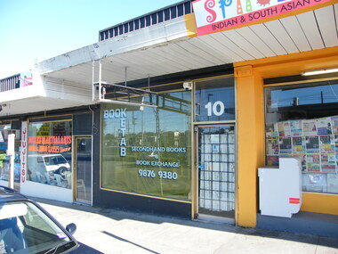 Photograph, Mixed Martial Arts, Secondhand books shop and asian grocery on Railway Place. South side of Railway Place