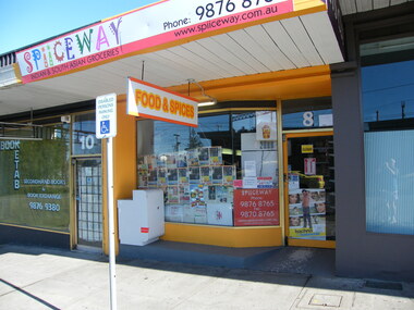 Photograph, Asian grocery on Railway Place. South side of Railway Place