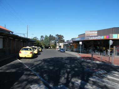 Photograph, South side of Railway Place pointing west. Showing taxi rank outside the railway station buildings