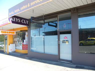 Photograph, South-east corner of 6 Railway Place. Showing Statewide Locksmiths and Asian grocery
