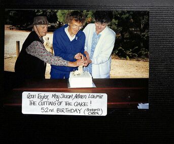 Photograph, Ringwood CWA 52nd Birthday, cutting the cake at Badger's Creek