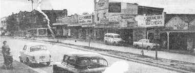 Photograph, Maroondah Highway Central, Ringwood. Main Street shops looking west from Warrandyte  Road, c1950's