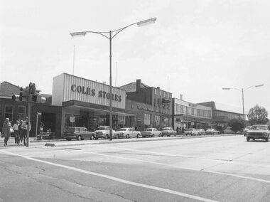 Photograph, Maroondah Highway Central, Ringwood. Shops in Maroondah Highway looking east from Ringwood Street. c1974