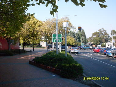 Photograph, Corner of Maroondah Highway and Wantirna Road looking south taken from Ringwood Street, Ringwood on 21 April 2009.  Memorial Clocktower in the distance with former Post Office location on left