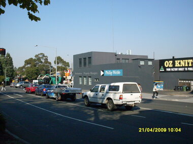 Photograph, Corner of Maroondah Highway and Ringwood Street looking south, Ringwood on 21 April 2009.  Ozknit and Phillip Webb Real Estate on west side of road