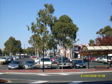 Photograph, Taken from Eastland, across carpark towards the bus terminus, looking south, on 21 April 2009. Showing rear of shops facing Maroondah Highway