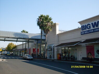 Photograph, Looking along Eastland access road looking west, on 21 April 2009. Showing entrance to Eastland, cafe and Big W store