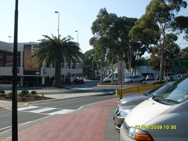 Photograph, Looking along Eastland access road looking east, on 21 April 2009. Showing entrance to Eastland carparks, and traffic roundabout