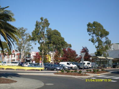 Photograph, Looking along Eastland access road towards the south-west, on 21 April 2009. Showing pedestrian crossing to south car park and shops