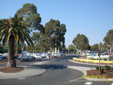 Photograph, Looking along former Adelaide Street, from the access road roundabout, towards the south-east, on 21 April 2009. Showing bus terminus on the other side of the highway, at the station