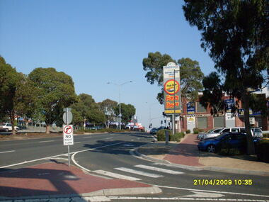 Photograph, Looking along Maroondah Highway towards the south-east, on 21 April 2009. Showing entrance to Ringwood Railway Station, Carter Real Estate and Fasta Pasta sign