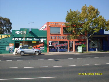 Photograph, Looking south-east at 146 and 144 Maroondah Highway showing tattoo parlor and Karl's 4WD & Car Service on 21 April 2009