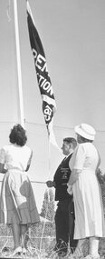 Photograph, Opening Jubilee Park. Ringwood Football Club, unfurling premiership flag, 1957