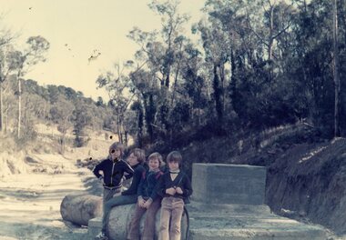 Photograph, Mark Bateson, Matthew Perry, Glen Doorey, Stewart Bateson on the manhole of the main drain in Kubis Drive, North Ringwood in Jan 1977