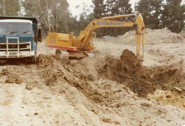 Photograph, The Kato machine working on the water-course under Kubis Drive, North Ringwood in Jan 1978