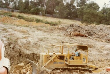 Photograph, Looking across Kubis Drive, North Ringwood in Jan 1978 showing tractor compacting road fill