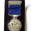 Engraved inscription on back of bar and on front of medal