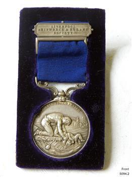 Engraved inscription on back of bar and on front of medal