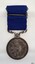 Silver medal has text and images