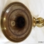 Close up of the candle pusher within the candlestick