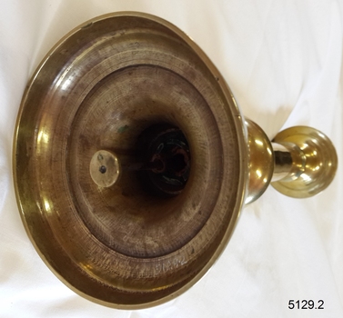 Close up of the candle pusher within the candlestick