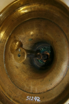 The inside shows the candle pusher inside the stem.