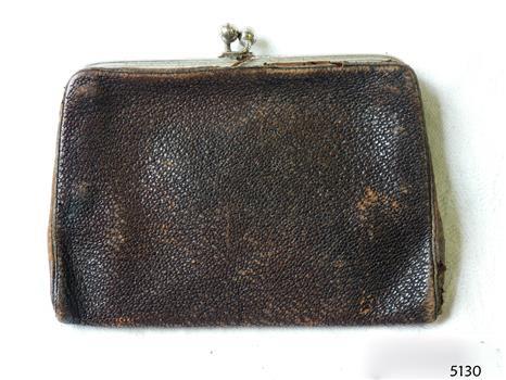 Rectangular black leather purse with metal frame and clasp