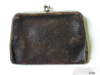 Rectangular black leather purse with metal frame and clasp