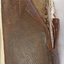 Brown leather back cover with crisscross pattern and spine