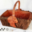 Rectangular basket, orange-brown fabric lining  covered outside with brown fabric, rosettes at base of handle