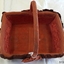 Internal lining of orange-brown fabric has same coloured floral motifs on the ends