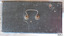Black painted wooden case has a U-shaped silver metal folding handle on top