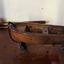 Rowing boat made of wood, oar behind it