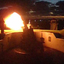 Fire flashes from the mouth of the cannon