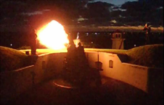 Fire flashes from the mouth of the cannon