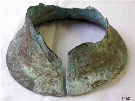 Image shows the jagged edge, the split and the verdigris