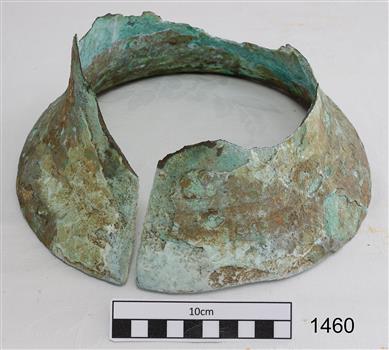 Lower section of a brass bell, split