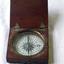 Wooden box with a hinged lid containing a magnetic compass
