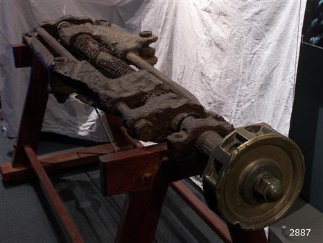 Ship's steering gear looks like petrified wood with interlocked gears and jointed rods