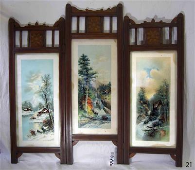 Wooden screen with three hinged panels, each with a coloured print behind glass
